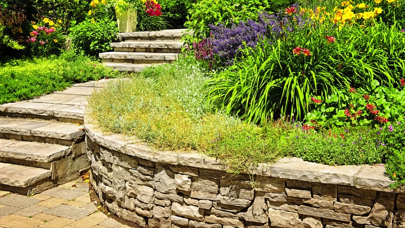 Natural stone retaining wall and garden edging for landscaped outdoor spaces