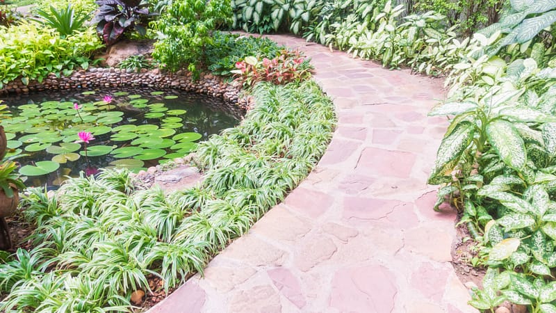 Stone garden edging with natural stone pathway for landscaped gardens and outdoor walkways